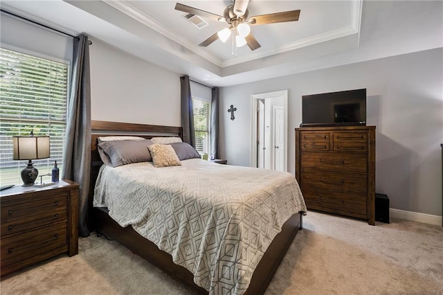 72158 Mill Rd, Abita Springs, LA 70420 - bedroom featuring a raised ceiling, light colored carpet, crown molding, baseboards, and a ceiling fan