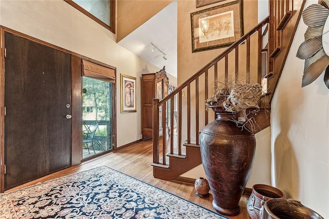 101 Lefleur Dr, Slidell, LA 70460 - entryway with light wood-type flooring, track lighting, and stairs