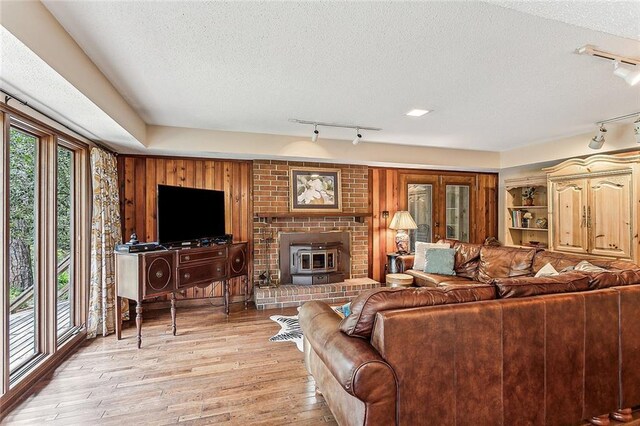 101 Lefleur Dr, Slidell, LA 70460 - living area featuring track lighting, a textured ceiling, and light wood finished floors