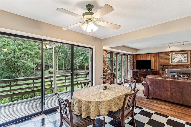 101 Lefleur Dr, Slidell, LA 70460 - dining area with a ceiling fan, track lighting, and a brick fireplace