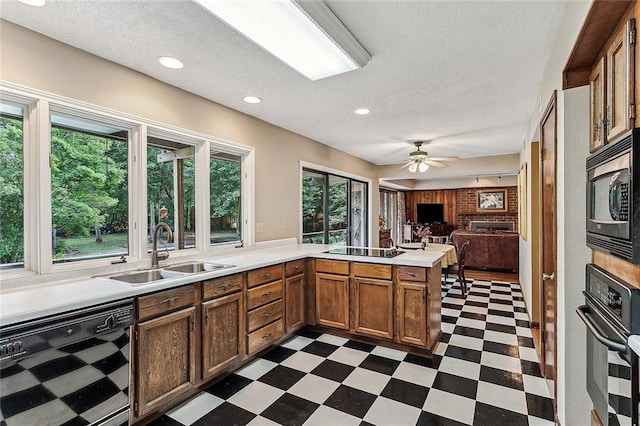 101 Lefleur Dr, Slidell, LA 70460 - kitchen featuring wine cooler, dark flooring, black appliances, light countertops, and a textured ceiling
