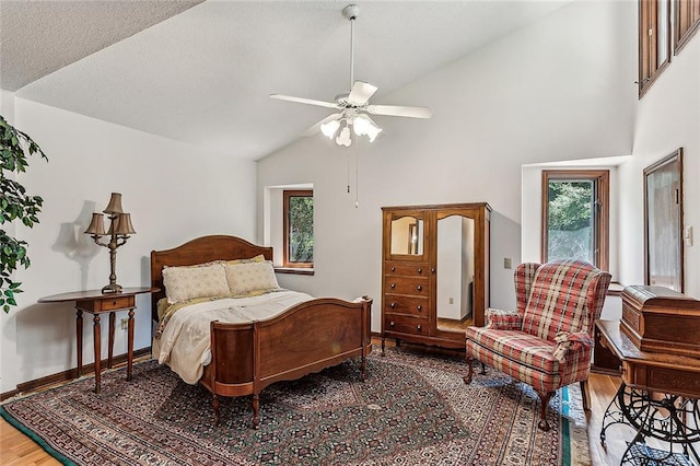 101 Lefleur Dr, Slidell, LA 70460 - bedroom with light wood-style flooring, multiple windows, high vaulted ceiling, and ceiling fan