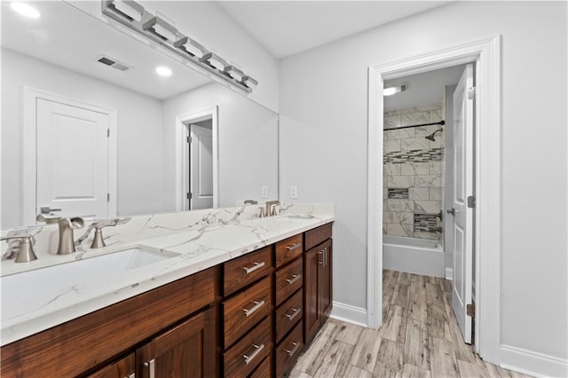 1037 Saint Joseph St, Slidell, LA 70460 - bathroom with double vanity, wood finished floors, shower / tub combination, and baseboards