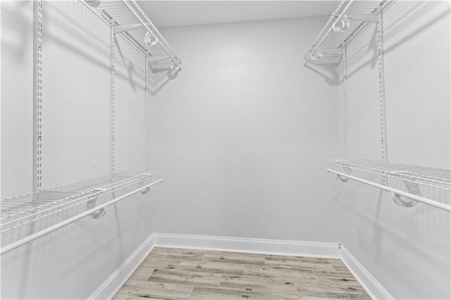 1037 Saint Joseph St, Slidell, LA 70460 - walk in closet with light wood-style flooring
