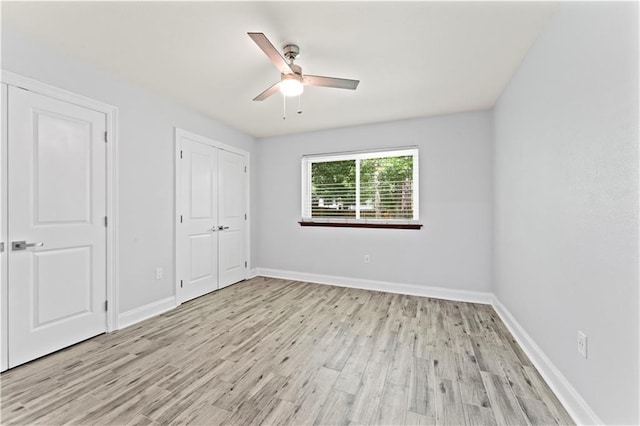 1037 Saint Joseph St, Slidell, LA 70460 - unfurnished bedroom with light wood-type flooring, baseboards, a closet, and a ceiling fan