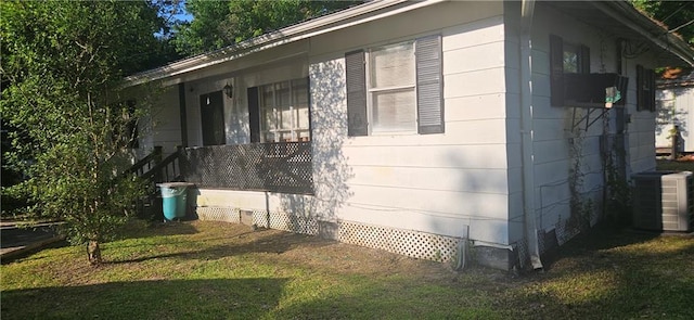 72422 Rose St, Covington, LA 70435 - view of property exterior with crawl space, a yard, central air condition unit, and covered porch