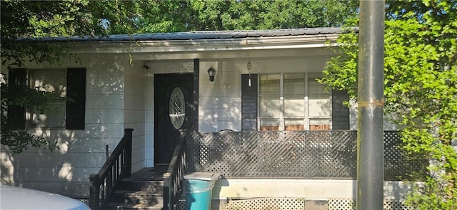 72422 Rose St, Covington, LA 70435 - property entrance with metal roof