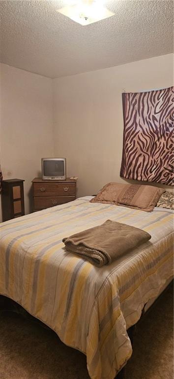 72422 Rose St, Covington, LA 70435 - bedroom featuring a textured ceiling and dark carpet