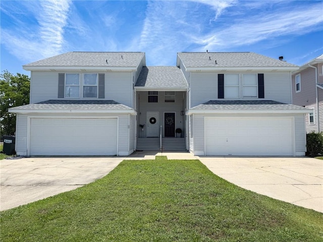 616 Marina Dr, Slidell, LA 70458 - traditional home with an attached garage, concrete driveway, a front yard, and roof with shingles