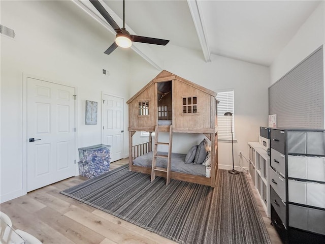 616 Marina Dr, Slidell, LA 70458 - bedroom featuring beam ceiling, wood finished floors, baseboards, and high vaulted ceiling