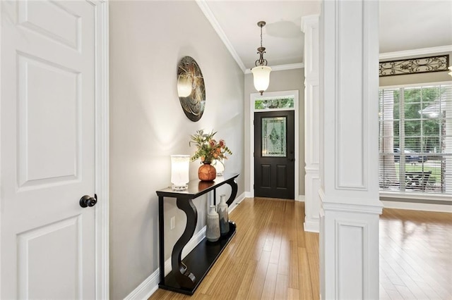 156 Egret St, Covington, LA 70433 - foyer entrance featuring baseboards, light wood-style floors, crown molding, and ornate columns