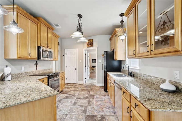 156 Egret St, Covington, LA 70433 - kitchen featuring stainless steel appliances, a sink, light stone countertops, and glass insert cabinets