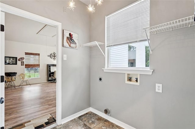 156 Egret St, Covington, LA 70433 - laundry room with hookup for an electric dryer, hookup for a washing machine, plenty of natural light, and baseboards