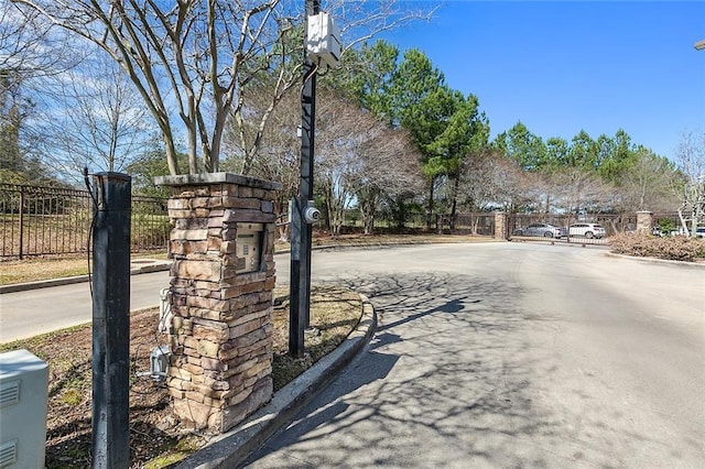 6765 Corporate Blvd Unit 11102, Baton Rouge, LA 70809 - view of asphalt street with curbs and a gated entry