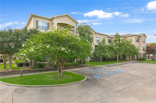 6765 Corporate Blvd Unit 11102, Baton Rouge, LA 70809 - view of building exterior with uncovered parking