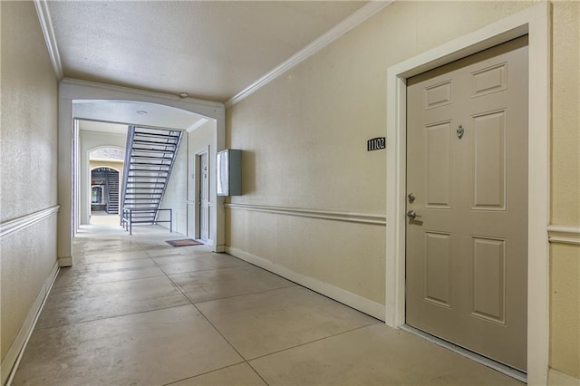 6765 Corporate Blvd Unit 11102, Baton Rouge, LA 70809 - hall with ornamental molding, arched walkways, baseboards, and concrete flooring