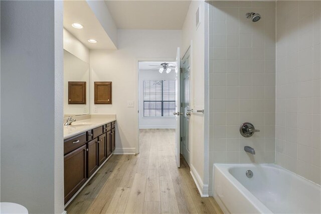 6765 Corporate Blvd Unit 11102, Baton Rouge, LA 70809 - bathroom with vanity, wood-type flooring, ceiling fan, baseboards, and recessed lighting