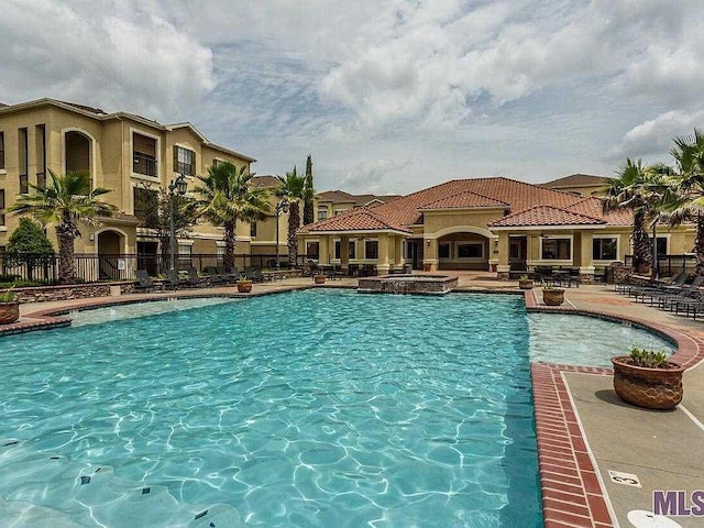 6765 Corporate Blvd Unit 11102, Baton Rouge, LA 70809 - view of pool with a pool with connected hot tub and a patio