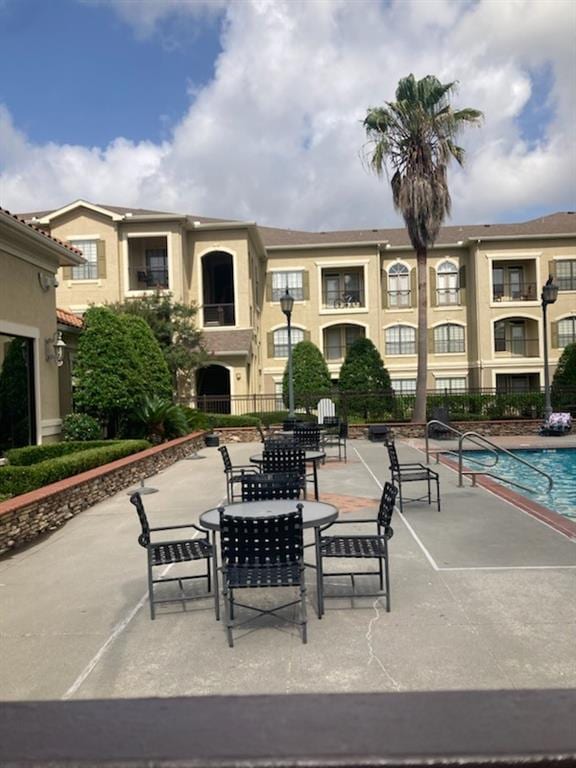 6765 Corporate Blvd Unit 11102, Baton Rouge, LA 70809 - view of property's community with a patio and a pool