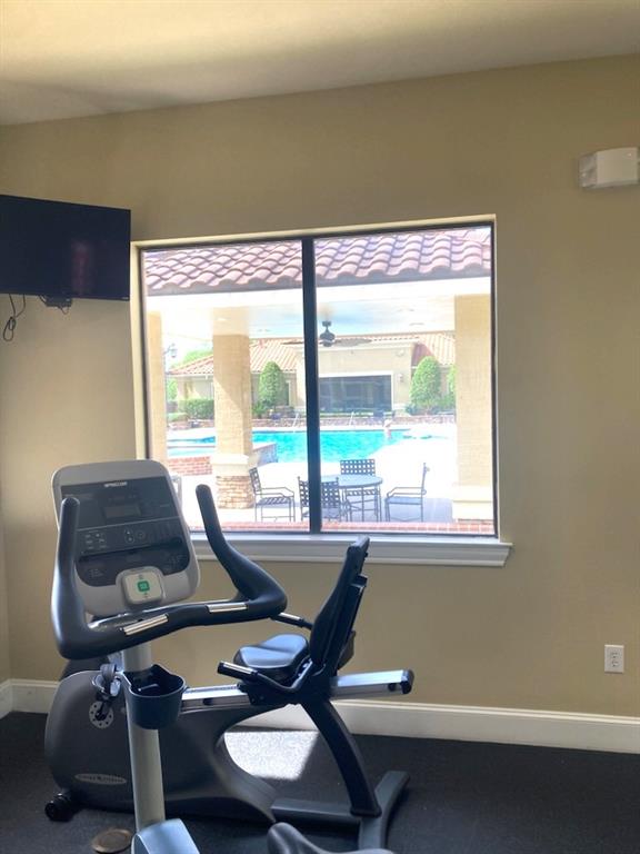 6765 Corporate Blvd Unit 11102, Baton Rouge, LA 70809 - workout room with baseboards