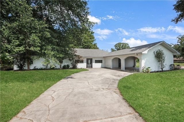 30425 Eden Church Rd, Denham Springs, LA 70726 - ranch-style home with concrete driveway, a front yard, and brick siding