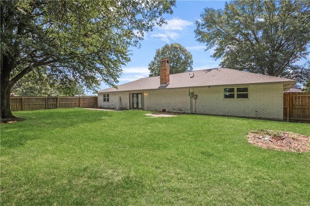 30425 Eden Church Rd, Denham Springs, LA 70726 - rear view of house featuring a chimney and brick siding