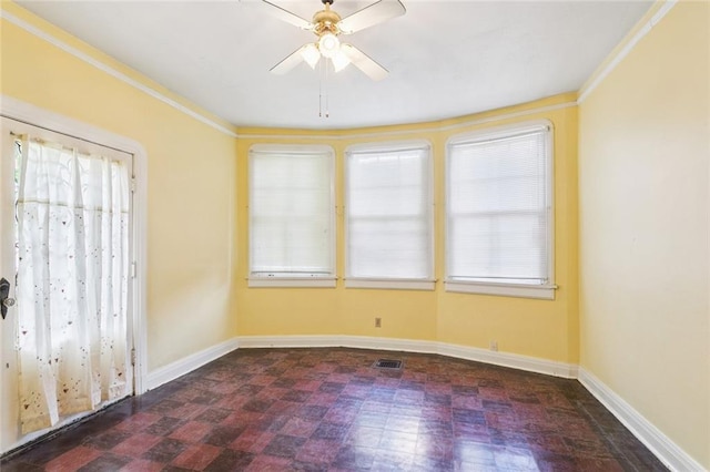1706 Metairie Rd, Metairie, LA 70005 - spare room with tile patterned floors, a ceiling fan, baseboards, and ornamental molding