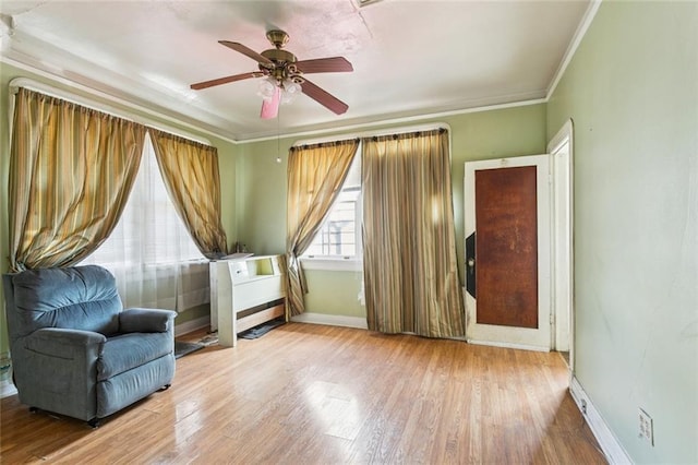 1706 Metairie Rd, Metairie, LA 70005 - living area featuring baseboards, wood finished floors, a ceiling fan, and crown molding