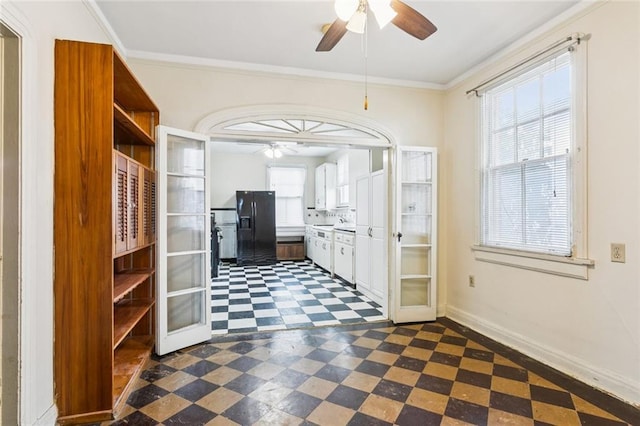 1706 Metairie Rd, Metairie, LA 70005 - kitchen featuring a ceiling fan, black fridge, dark floors, open shelves, and white cabinetry