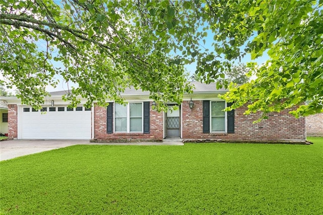 106 Matthews Dr, Slidell, LA 70458 - view of front of property with concrete driveway, a garage, a front yard, and brick siding