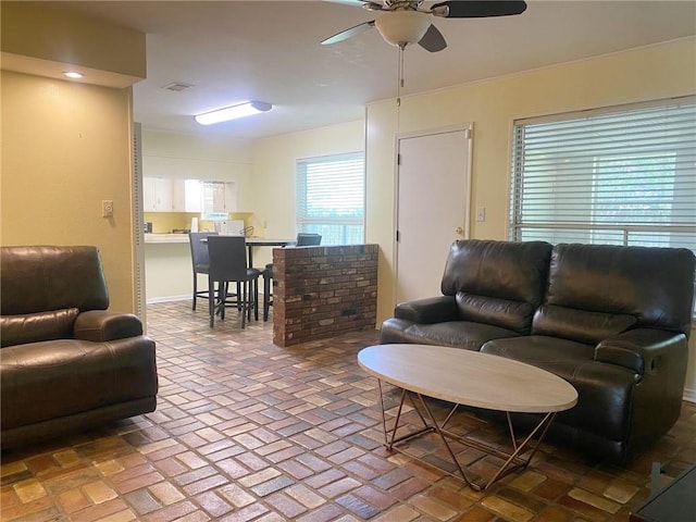 106 Matthews Dr, Slidell, LA 70458 - living area with ceiling fan and brick flooring