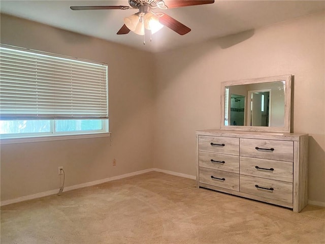 106 Matthews Dr, Slidell, LA 70458 - unfurnished bedroom featuring light carpet, baseboards, and a ceiling fan