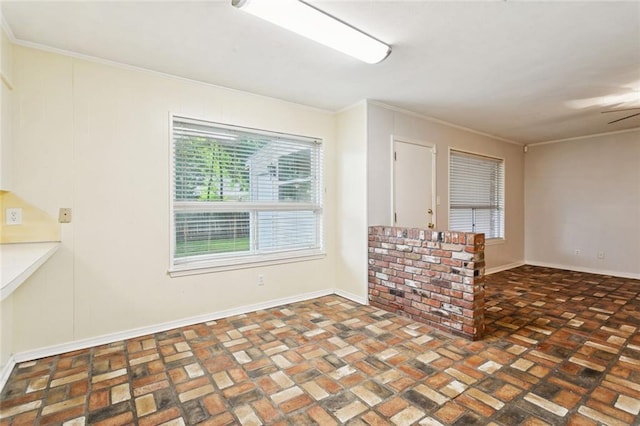 106 Matthews Dr, Slidell, LA 70458 - empty room featuring brick patterned floors, ornamental molding, and ceiling fan