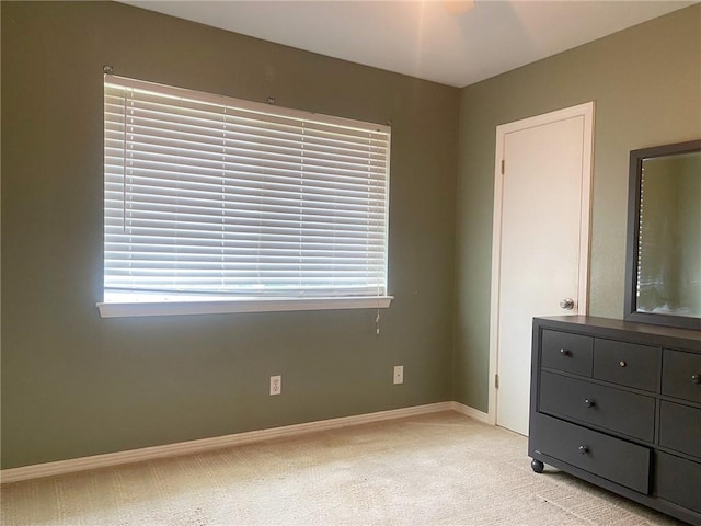 106 Matthews Dr, Slidell, LA 70458 - unfurnished bedroom with light colored carpet, baseboards, and multiple windows