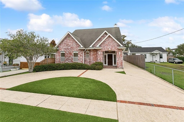 1715 Demosthenes St, Metairie, LA 70005 - craftsman inspired home with a chimney, brick siding, curved driveway, and a shingled roof