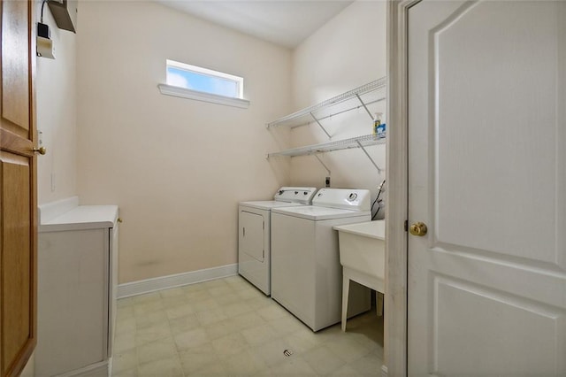1715 Demosthenes St, Metairie, LA 70005 - laundry area with washing machine and clothes dryer, light floors, and baseboards