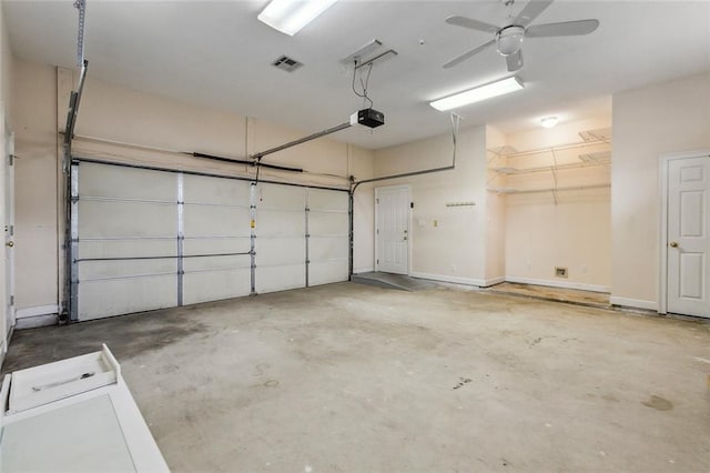 1715 Demosthenes St, Metairie, LA 70005 - garage featuring a garage door opener, ceiling fan, and baseboards