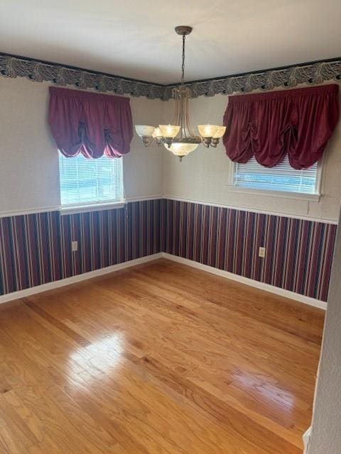3107 Metairie Heights Ave, Metairie, LA 70002 - spare room with wood finished floors and a chandelier