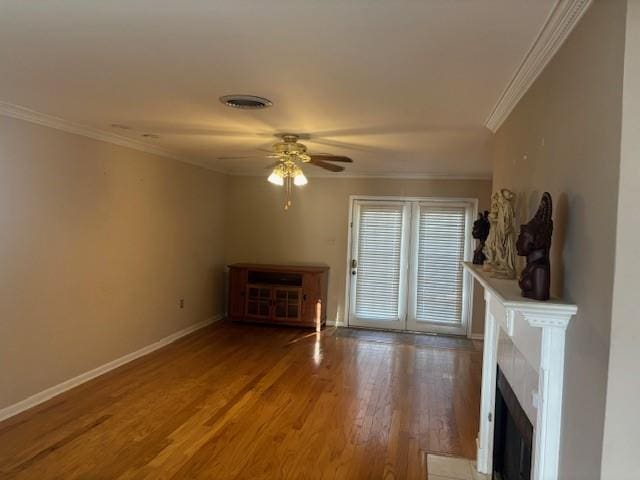 3107 Metairie Heights Ave, Metairie, LA 70002 - unfurnished living room featuring crown molding, a ceiling fan, wood finished floors, a fireplace, and baseboards