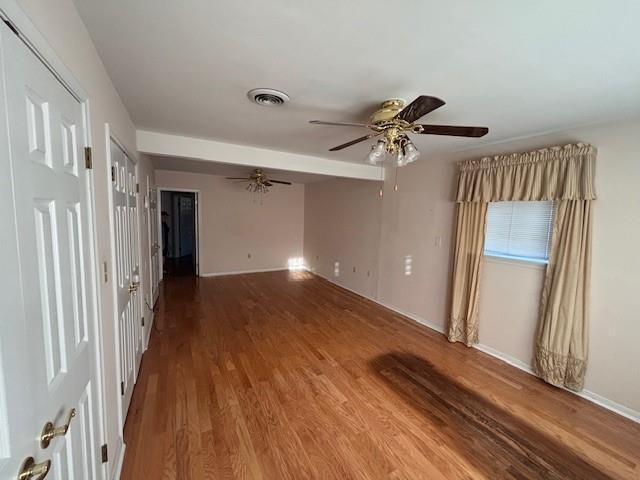 3107 Metairie Heights Ave, Metairie, LA 70002 - spare room featuring wood finished floors, ceiling fan, and baseboards