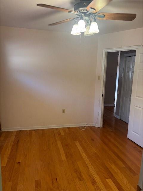3107 Metairie Heights Ave, Metairie, LA 70002 - empty room with a ceiling fan, light wood-type flooring, and baseboards
