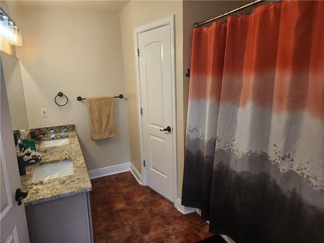 68 Camelia Trce, New Orleans, LA 70114 - bathroom with baseboards and double vanity