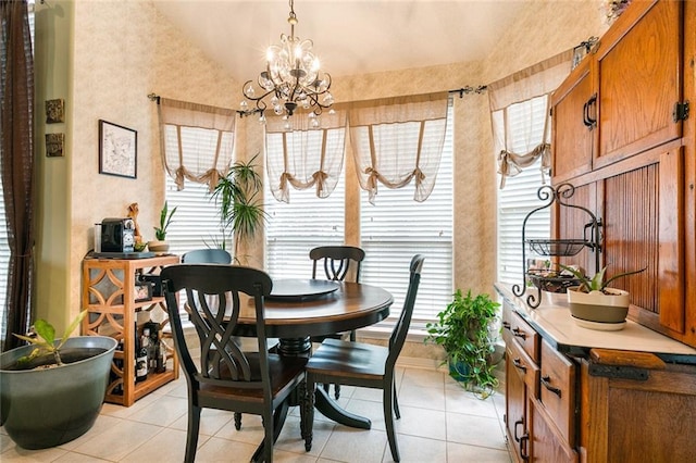 219 Bamboo Dr, Covington, LA 70433 - dining room with lofted ceiling, light tile patterned floors, and a chandelier