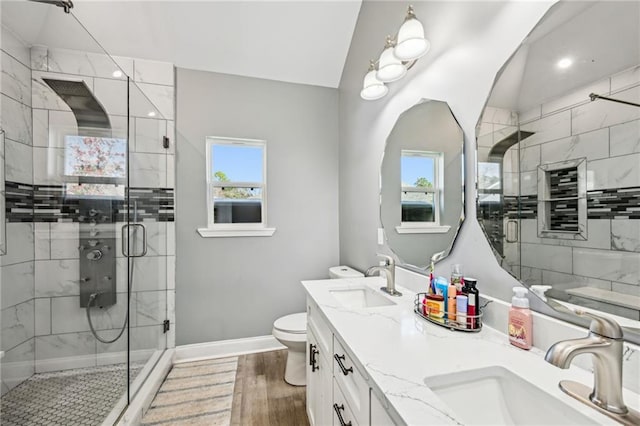 212 W Field Ct, Mandeville, LA 70471 - bathroom featuring a shower stall, double vanity, and wood finished floors