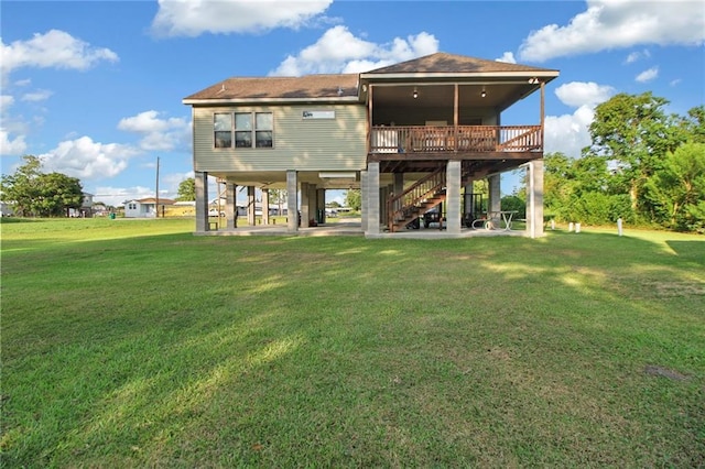 2634 Privateer Blvd, Barataria, LA 70036 - rear view of property featuring stairway, a lawn, a carport, and a deck
