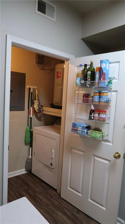 350 Emerald Forest Blvd Unit 17103, Covington, LA 70433 - laundry room with electric panel, washer / dryer, and dark wood-style floors