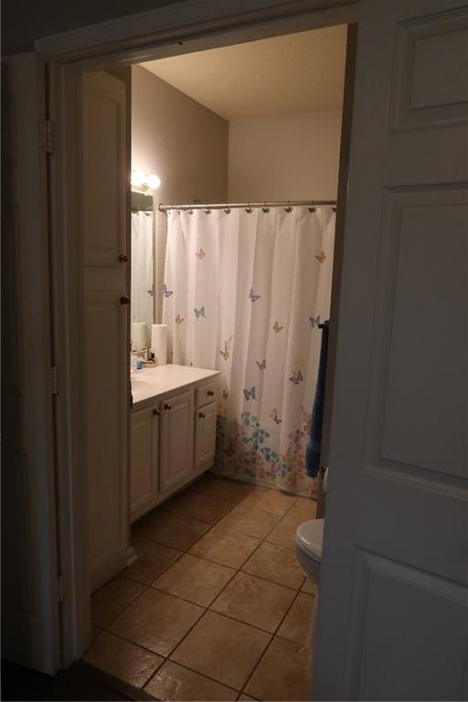 350 Emerald Forest Blvd Unit 17103, Covington, LA 70433 - full bathroom with vanity, tile patterned floors, and a shower with shower curtain