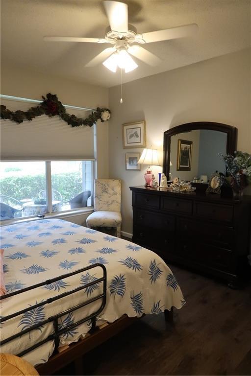 350 Emerald Forest Blvd Unit 17103, Covington, LA 70433 - bedroom with wood finished floors and ceiling fan