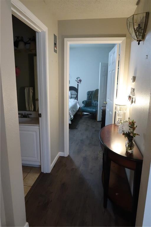 350 Emerald Forest Blvd Unit 17103, Covington, LA 70433 - hallway with a sink and wood finished floors
