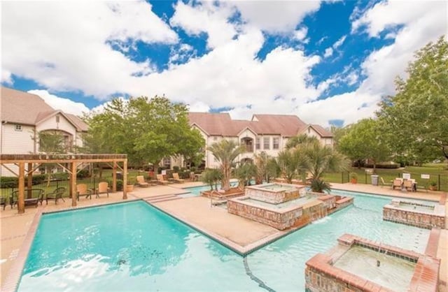 350 Emerald Forest Blvd Unit 17103, Covington, LA 70433 - view of pool featuring a pergola, a patio, and a pool with connected hot tub